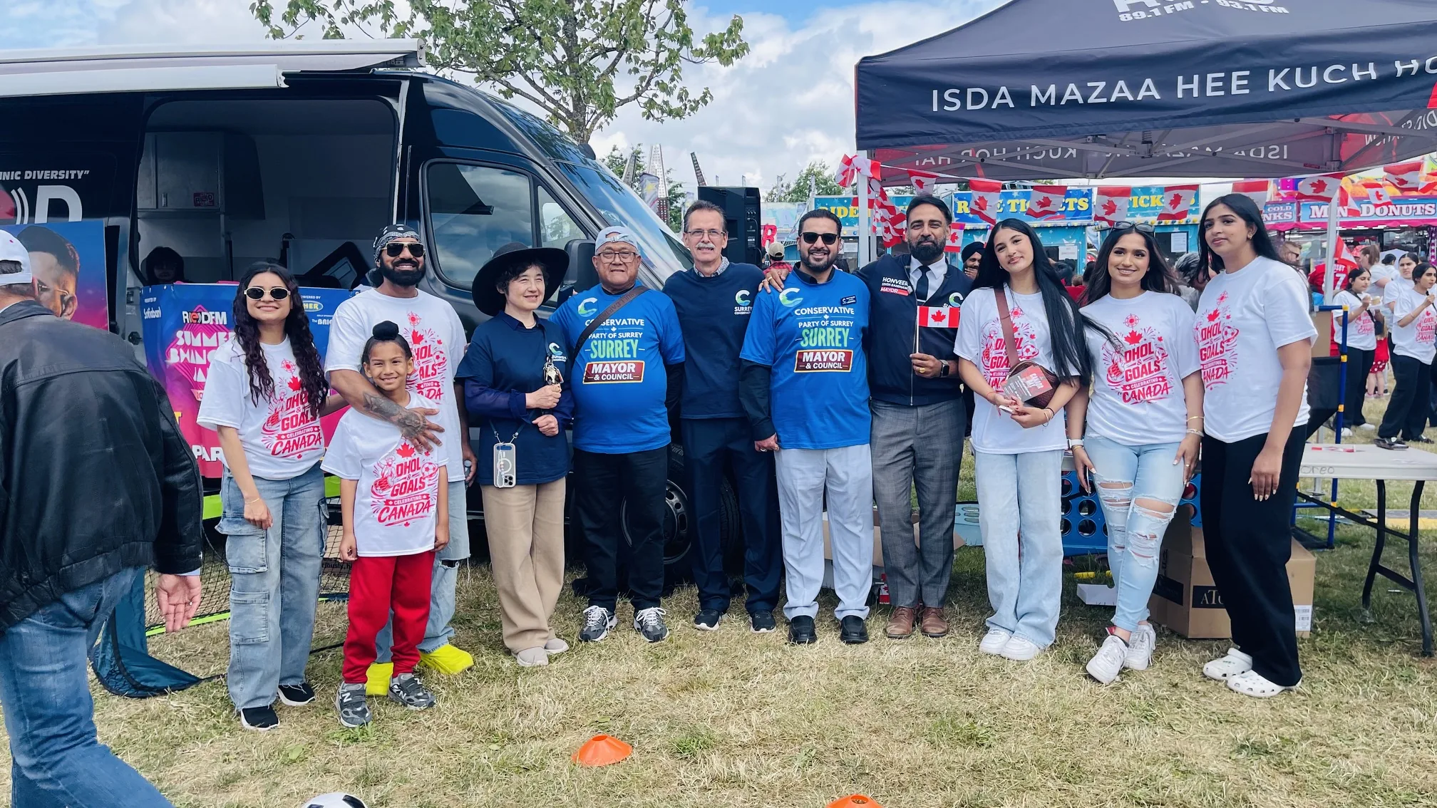 Dan B. Carlos and campaign team with community members at a Surrey Canada Day event